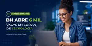 Jovem mulher em escritório moderno trabalha em laptop